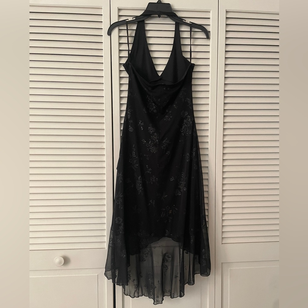Black flowy midi dress with flower design slightly worn shown on last picture